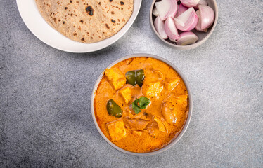 Kadai Paneer is a spicy, flavourful and delicious gravy dish made with  paneer, bell pepper, and onion in a freshly ground spice and served with chappati or lachcha parantha
