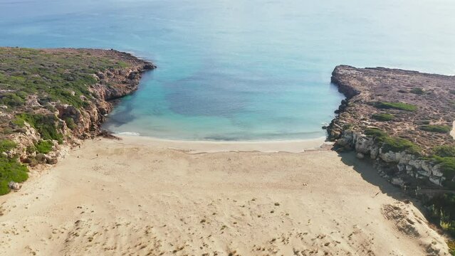 Turquoise Water Of Calamosche Beach In Vendicari Natural Reserve In Sicily, Italy - aerial pullback