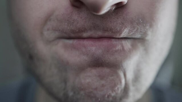 Emotions of wrath and anger in a young man on his face. Close-up