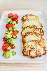 Salty pancakes with fresh mediterranean salad