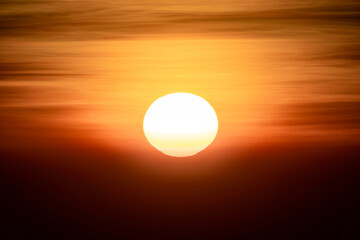 The sun is rising in the dark environment for any hopeful concept background. It’s shot at Thailand in January 2022.