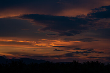 Fototapeta premium Senset moment view behind the mountain in the golden light from the sun.
