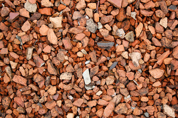 top view on red stones texture on the ground as natural background, red stones wallpaper, red stones textured backdrop, directly above shot of red stones, brown gravel, patterned background, outdoor