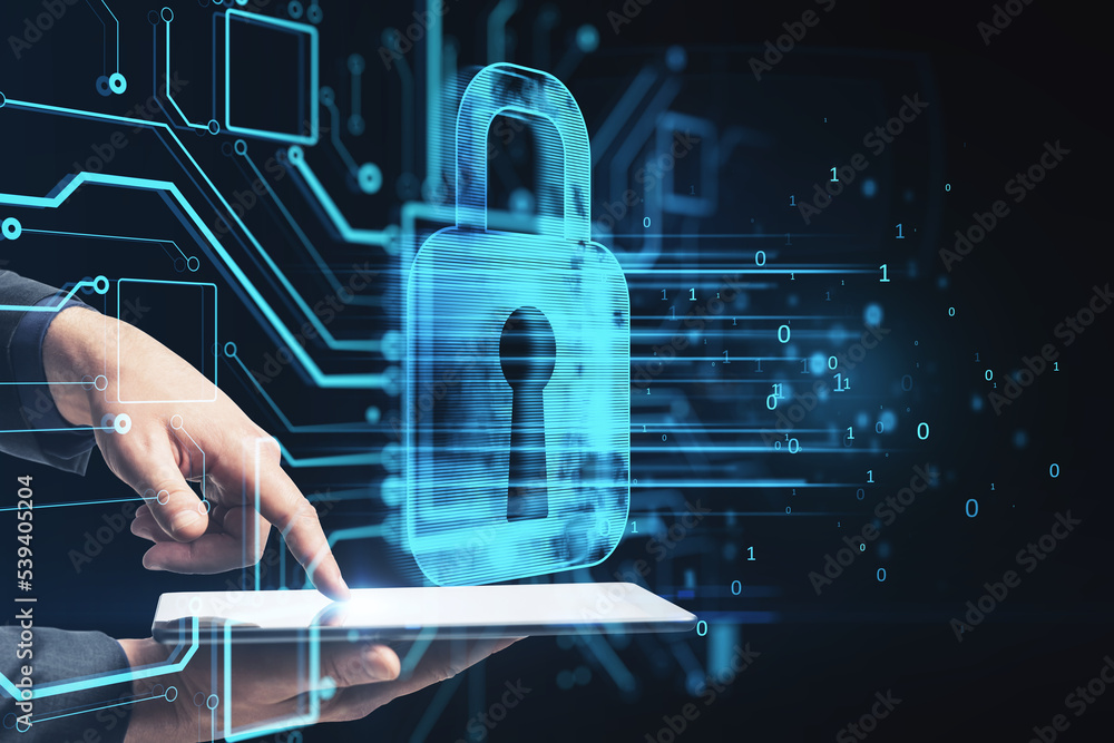 Poster close up of businessman hand pointing at tablet with abstract glowing padlock hologram on dark backg