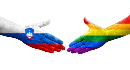 Handshake between LGBT and Slovenia flags painted on hands, isolated transparent image.