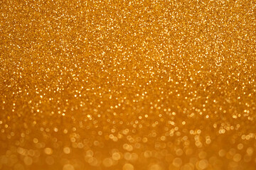 Abstract Glitter Background. Golden Texture Sparkling Shiny Paper for Christmas Holiday. Seasonal Wallpaper Decoration. Greeting and Wedding Invitation Card Design. Sparkle Lights and Bokeh Backdrop.