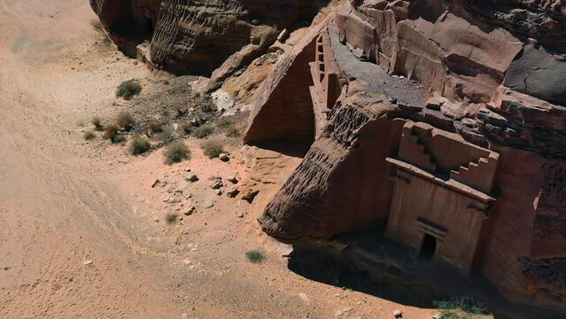 Aerial view around rock carved tombs at Al-Hijr, Hegra, Madain Salih Archaeological Site in sunny Saudi Arabia