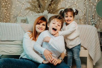 Obraz premium family having fun, mother daughter and brother.