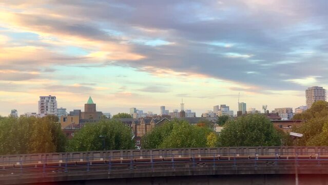 Window view travelling on DLR tube through Deptford in East London