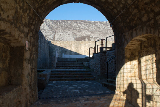Entrance of the medieval stone castle in Drivenik, Croatia, look inside
