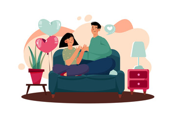 The couple sits and talks a good conversation on a sofa.