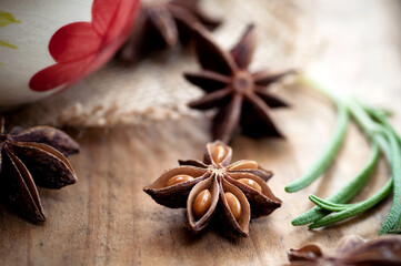 Anise stars on wooden surface