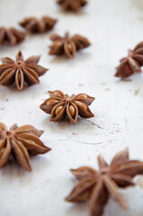 Anise stars on wooden surface