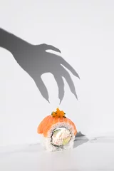 Crédence de cuisine en verre imprimé Bar à sushi Sushi Halloween on white background. Maki roll with witch hand shadow. Creative party food. Spooky, scary, fun, bewitched California with salmon. Japanese sushi bar, restaurant holiday menu. Vertical