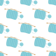 seamless pattern of cartoon knitting cloth with knitting needles