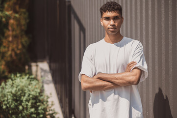 Young guy in white tshirt looking confident