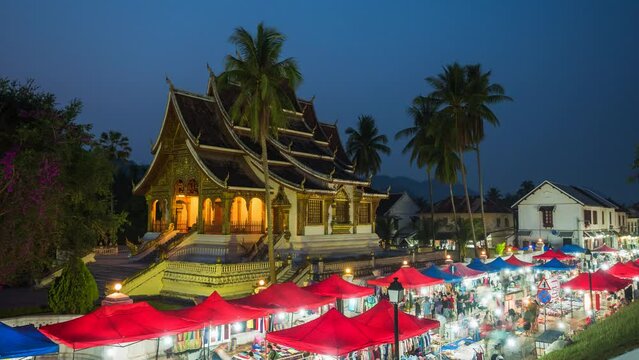 Time lapse view of traditional night market with crafts and souvenirs in Luang Prabang, Laos.