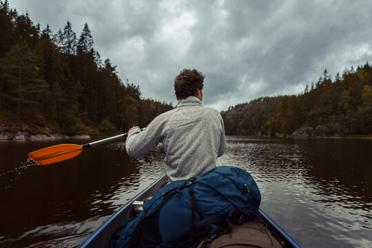 Man Canoeing On Lake