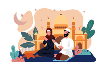 Muslim couple are reading Al Quran in front of Mosque