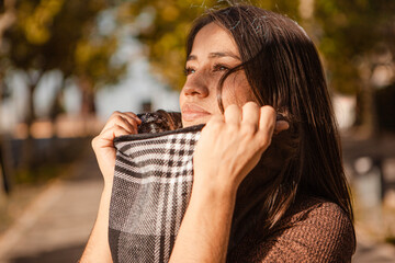 Portrait of latin american woman breathing in the park in autumn