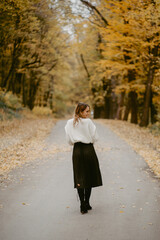 Woman walking in the autumn park, a healthy lifestyle, walk, exercise