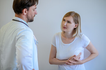 Adult woman discussing her health problems with a doctor