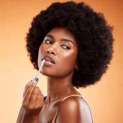 Black woman, afro and natural beauty lip gloss treatment for a healthy, shiny and transparent tint....