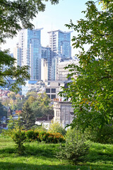 Fototapeta premium View from the botanical garden on modern houses in the city of Kyiv 