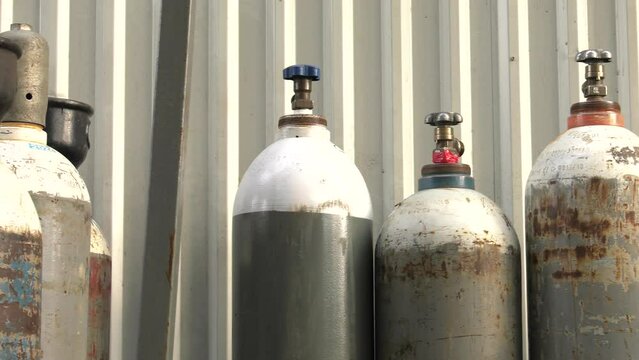 Cylinder valve. Gas bottling plant. 4K, UHD, 50p, Panning,Close-up, 