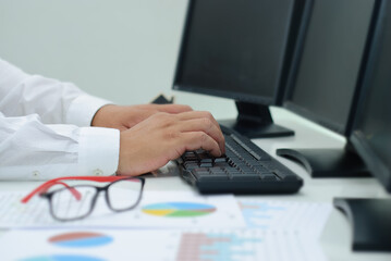 Concept of technology. business people use computers to analyze data business and investment Stock market and digital funds Business assets analyzing charts, trading, financial data.