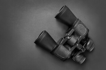 Binoculars on black background