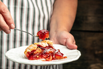plum pie powdered sugar is sprinkled on the cake. Cut pieces of pie on plate. Food recipe background. Close up