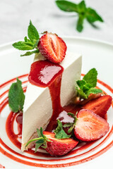 delicious homemade strawberry cheesecake with fresh strawberries, jam and mint