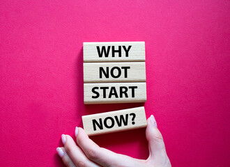 Why not start now symbol. Concept words Why not start now on wooden blocks. Beautiful red background. Businessman hand. Business and Why not start now concept. Copy space.