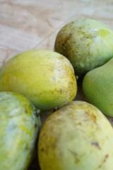 close up of five fresh mangoes