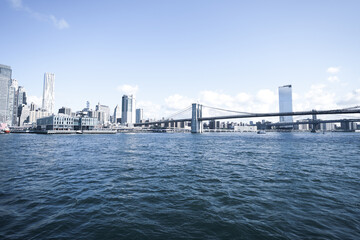 New York City, New York USA - September 2022. Manhattan bridge. Iron bridge view. Historic New York place. Brick wall buildings. Brownstone building.