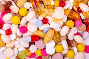 background of colorful tablets and capsules