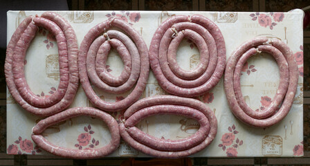 Pork susages. Traditional polish raw meat sausages on table