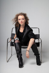 Fototapeta premium woman sitting on chair