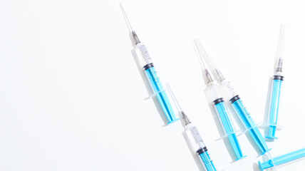 Fototapeta premium Disposable plastic syringe prepared for injection and vaccination in the hospital. The concept of medicine and health
