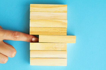 Woman hand stacked wooden blocks with space for text