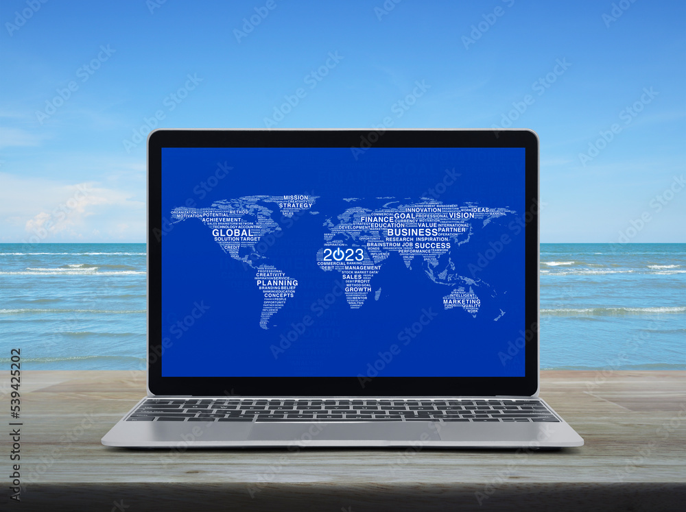 Poster start up 2023 business icon with global words map on laptop computer screen on table over sea and sk