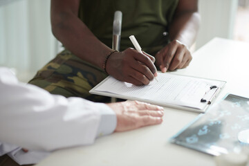 Ex-soldier Filling Medical Document