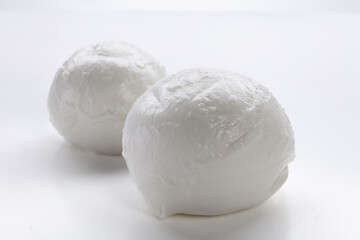whole mozzarella on white background