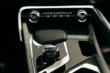 Closeup of automatic transmission inside car salon