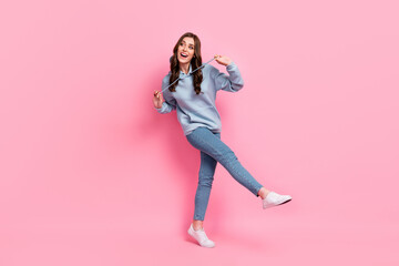 Fototapeta na wymiar Full size portrait of overjoyed satisfied girl enjoy dancing clubbing hands play hoodie lace isolated on pink color background