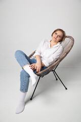 Fototapeta na wymiar girl sitting in a chair
