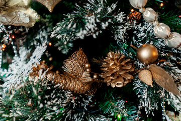 Decorated Christmas tree with balls, beads, baubles.