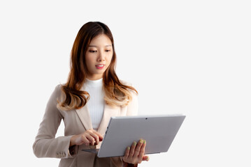 Asian pretty businesswoman holding notebook touching screen white background.
