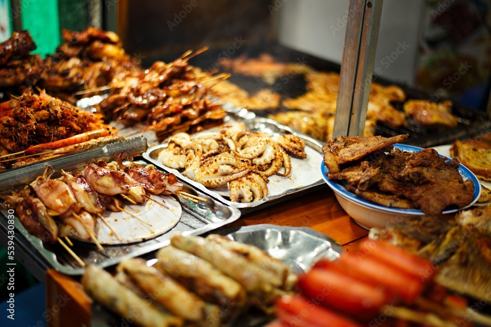 Wall mural Grilled seafood on Vientnam, evening time, shallow deph of field